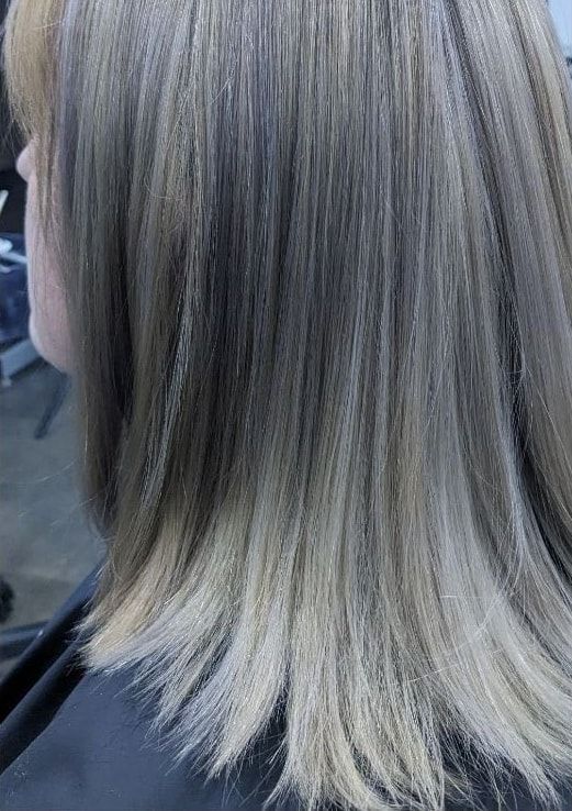 Even, cool silver blonde hair following a color correction on a real client