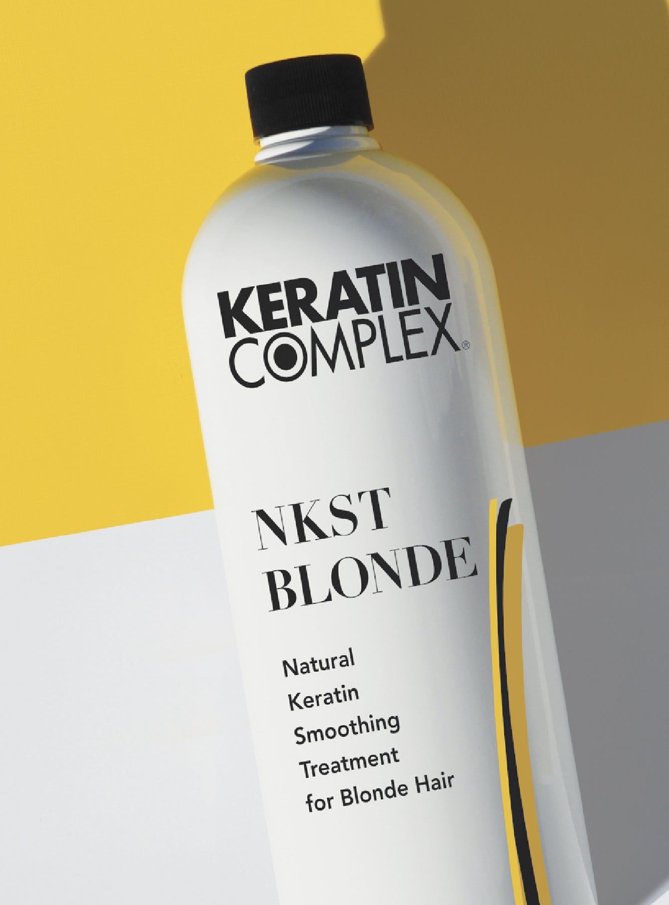 Keratin Complex product photo: the NKSTB bottle for blonde hair, shown against gold